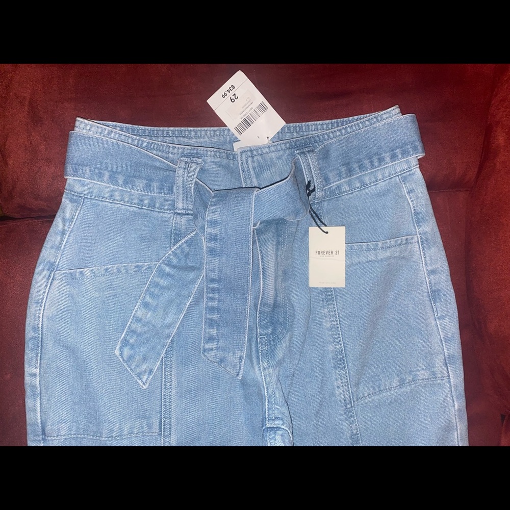 Forever 21 Denim light wash blue jeans with tie belt.